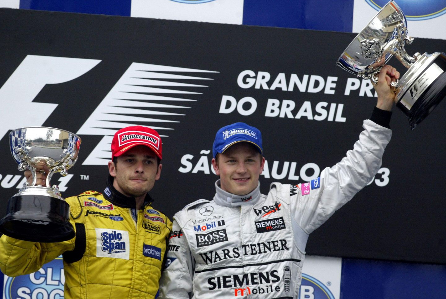 Подиум Гран При Бразилии-2003. Третий призер Фернандо Алонсо в награждении не участвовал, так как находился на медицинском обследовании © F1