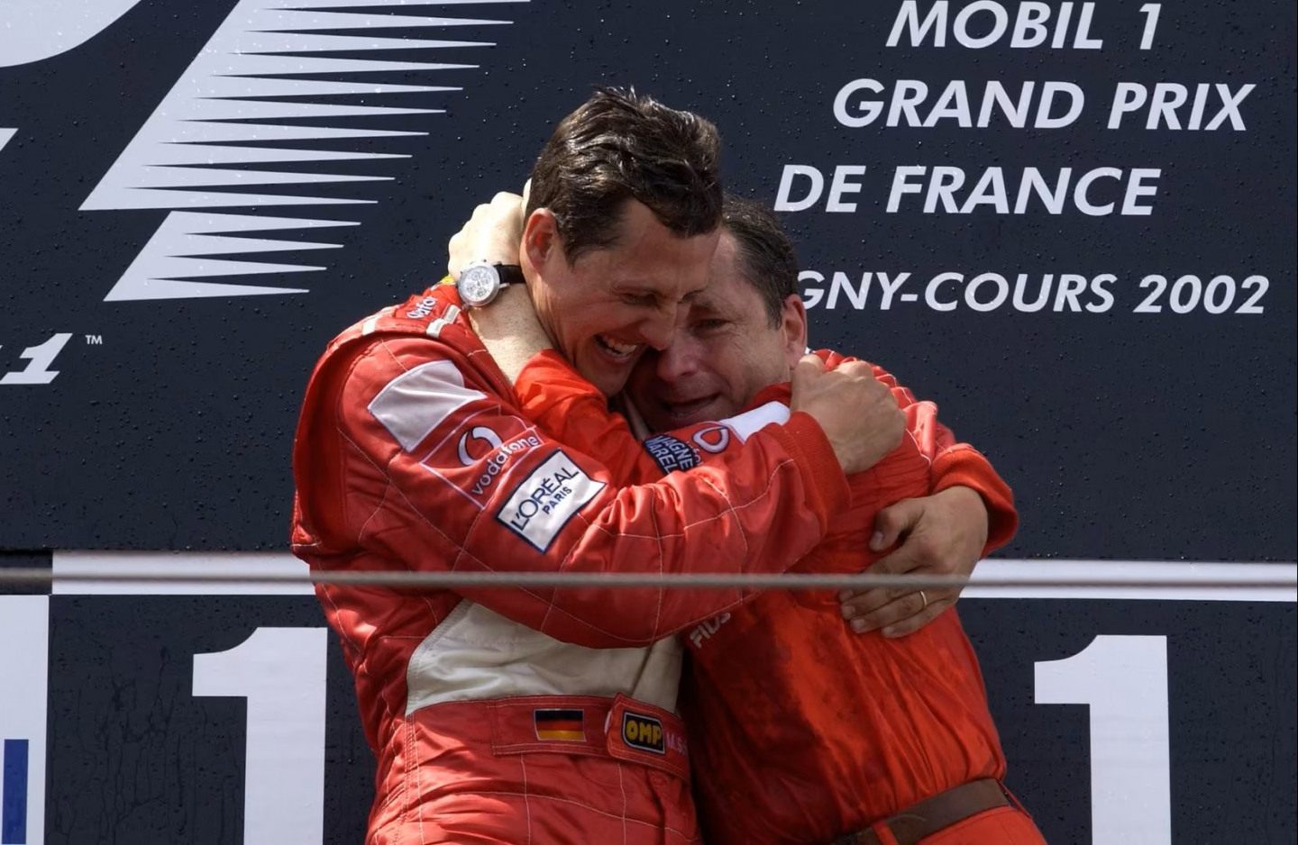 Шумахер и Тодт на подиуме Гран При Франции-2002. Михаэль досрочно стать пятикратным чемпионом мира Ф1 и сравнялся с Хуаном Мануэлем Фанхио © Ferrari